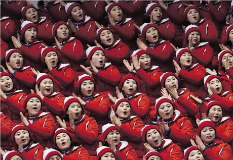  ?? ARIS MESSINIS/AFP/GETTY IMAGES ?? North Korean cheerleade­rs are a contingent 230 strong and known as the Army of Beauties.