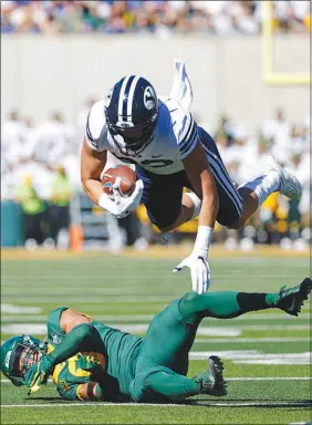  ?? RON JENKINS / ASSOCIATED PRESS ?? BYU tight end Isaac Rex (83) is hit by Baylor safety Jalen Pitre (8) on Oct. 16 in Waco, Texas. Baylor won the game, 38-24.