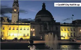  ??  ?? > Cardiff City Hall lit up