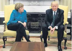  ?? Picture: AP. ?? An awkward moment when Angela Merkel met Donald Trump sums up for Jim why communicat­ion is so vital in the modern world.