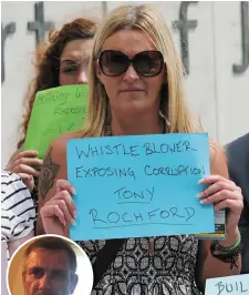  ??  ?? Gillian Wall, the sister of Tony Rochford (inset), protests against his conviction outside Dublin Circuit Criminal Court