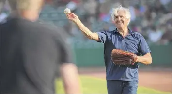  ?? Lori Van Buren / Times Union ?? Former senate majority leader Joe Bruno warms up his arm before throwing out the first pitch for the Tri-city Valleycats baseball game in 2014 in Troy.