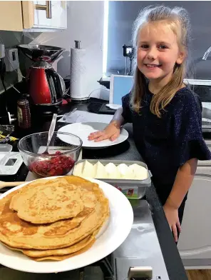  ??  ?? Star of the show... Edith Coombes impresses with her festive pancakes