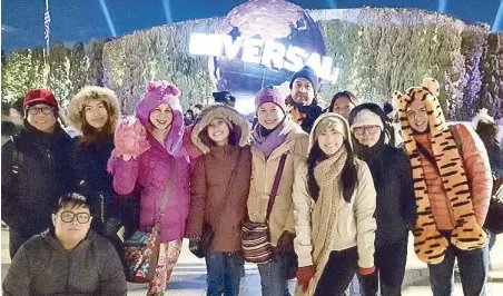  ??  ?? Our group posing in front of the Universal Globe. (From left) Mike Mina, Matthew Dayrit (seated), Alexandra Dayrit, Michelle Dayrit, Carin Romualdez, Yvonne Romualdez, Mark Dayrit, author Christine Dayrit, Samantha Dayrit, Mylene Dayrit and Vincent...