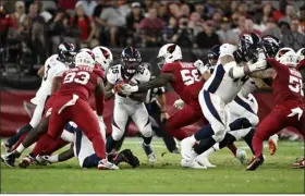  ?? RJ SANGOSTI — THE DENVER POST ?? Broncos running back Samaje Perine looks for a hole to run against the Cardinals during the first preseason game on Aug. 11at State Farm Stadium in Glendale, Ariz.