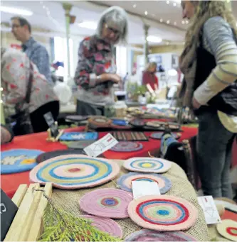  ?? CLIFFORD SKARSTEDT/ EXAMINER FILE PHOTO ?? Shoppers browse during the second annual Finer Things Handmade Holiday Show and Sale on Dec. 10 at Seeds Of Change in Peterborou­gh. The sale returns Saturday. Handmade items included ceramics, paintings, sculptures, glass and rock pendants, glass...