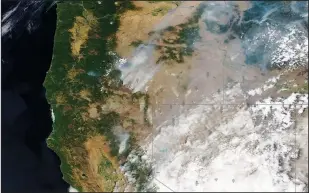  ??  ?? This satellite image shows an overview of wildfires July 18 from Oregon, Idaho and Northern California. (AP/Satellite image 2021 Maxar Technologi­es)