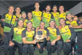  ?? GETTY IMAGES ?? The Australia team with the TriSeries trophy after beating New Zealand on Wednesday.