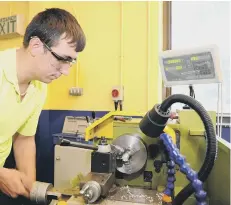  ??  ?? Vogal Training apprentice Matthew Holland working on a lathe.