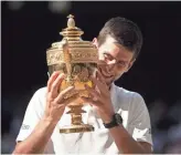  ?? SUSAN MULLANE/USA TODAY SPORTS ?? Novak Djokovic defeated Kevin Anderson 6-2, 6-2, 7-6 (3) to win his fourth trophy at Wimbledon on Sunday.