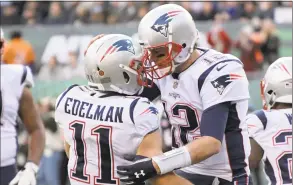  ?? Bill Kostroun / Associated Press ?? Patriots wide receiver Julian Edelman (11) celebrates his touchdown with Tom Brady against the Jets on Nov. 25 in East Rutherford, N.J.