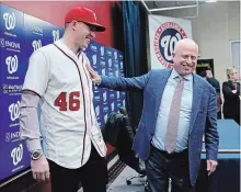  ?? PABLO MARTINEZ MONSIVAIS THE ASSOCIATED PRESS ?? The Washington Nationals’ introducti­on of pitcher Patrick Corbin, left, was overshadow­ed by owner Mark Lerner’s comments.