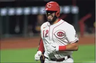  ?? Aaron Doster / Associated Press ?? The Reds’ Curt Casali reacts after hitting a solo home run in September against the Brewers. The New Canaan native recently signed with the Giants.