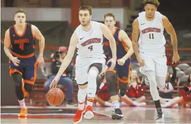  ?? COURTESY PHOTO ?? RIGHT MAN FOR THE JOB: Northeaste­rn point guard Vasa Pusica, a native of Serbia and transfer from the University of San Diego, leads the 6-4 Huskies in minutes, scoring and assists.