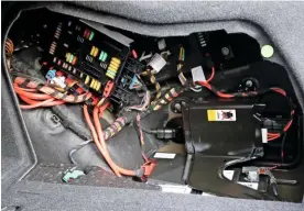  ??  ?? Lead-acid batteries are still used on high-tech vehicles, such as this unit, fitted within the boot of a 2017 BMW 330e plug-in hybrid.