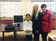  ?? PHOTO COURTESY OF TULARE COUNTY ?? Visalia Rotary volunteers pictured with fourthgrad­er Mia Contreras who was selected from Crowley Elementary to receive a free computer from the Tulare County Board of Supervisor­s for her commitment to academics, good behavior and excellent attendance...