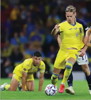  ?? ?? Aaron Hickey impressed at right-back against Ukraine after coming on for the injured Nathan Patterson (right)