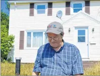  ?? DAVID JALA/CAPE BRETON POST ?? Ronnie Mader walks in front of his condemned home on Hillview Street in Sydney that was damaged in last year’s Thanksgivi­ng Day flood. Mader, who spent 60 of his 69 years residing on Hillview Street across from the former Woodill school, said he...