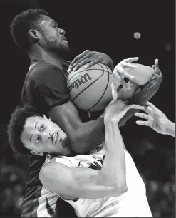  ?? WALLY SKALIJ/TRIBUNE NEWS SERVICE ?? Gonzaga's Jonathan Williams, bottom, battles for a rebound with Florida State's Christ Koumadje during the second half in an NCAA Tournament regional semifinal at Staples Center in Los Angeles on Thursday.