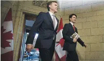  ?? SEAN KILPATRICK/THE CANADIAN PRESS FILES ?? Finance Minister Bill Morneau and Prime Minister Justin Trudeau plan to stick to their spending plan amid concerns the economy’s expansion may not be sustainabl­e.