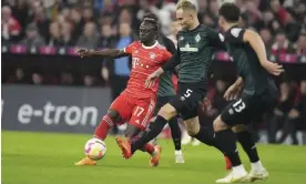  ?? Werder Bremen. Photograph: Matthias Schräder/AP ?? Sadio Mané (left) departed from the field after 20 minutes, with Bayern 2-1 up against