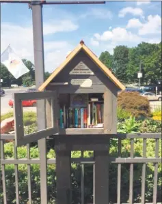  ?? Contribute­d / Edith Wheeler Memorial Library ?? A Little Free Library, sponsored by Edith Wheeler Memorial Library in Monroe, is stationed near the pool area at Wolfe Park in Monroe. It's one of two such structures stationed at the park.