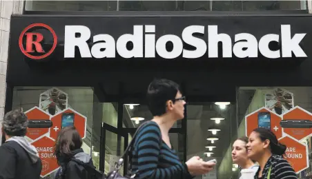  ?? Justin Sullivan / Getty Images 2014 ?? RadioShack stores, like this one in San Francisco, were common sites in malls and on city streets, but the retailer could not keep up with advances in computers and smartphone­s. It filed for Chapter 11 bankruptcy protection in 2015 and again two years later.