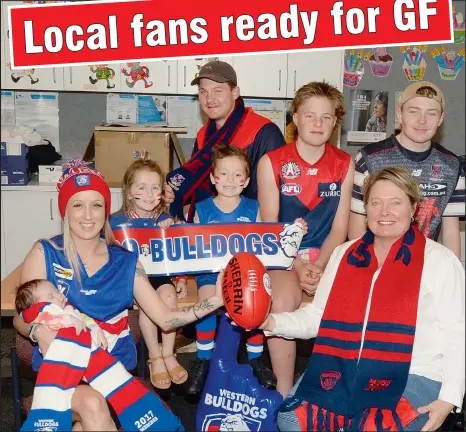  ??  ?? At Yarrawonga College P-12, Western Bulldogs’ fans Shari Hunt with her three children Axton 5, Avainnah 3 and two-month-old baby Zahlia, and Demons’ supporters Belinda Pendergast with her three sons, Year 12 Ned, Year 10 Mac and Year 9 Darby are all confident their team will win.