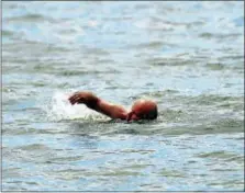  ?? PETER HVIZDAK — NEW HAVEN REGISTER ?? Miles Hayden of Branford, who swims on consecutiv­e days from May into November, is shown swimming near Branford Point at Parker Memorial Park in Branford. Wednesday.