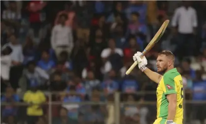  ?? Photograph: Rafiq Maqbool/AP ?? Australia captain Aaron Finch celebrates reaching his century in Australia’s first ODI win over India.