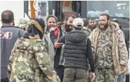  ?? Sameer Al-doumy / AFP / Getty Images ?? Rebels evacuated from the Damascus area are greeted upon arriving in the northern countrysid­e.