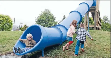  ?? Photo: MYTCHALL BRANSGROVE/FAIRFAX NZ ?? Having fun: The new slide at the Fairlie playground has proved popular. Pictured at the end of the slide is Neve Kellahan and running to the front are Isabelle and Nicholas Miles.