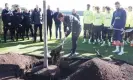  ?? Photograph: Tottenham Hotspur FC/Getty Images ?? Antonio Conte and his players plant a tree in memory of Gian Piero Ventrone, the Spurs fitness coach who died last week at the age of 61.