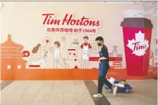  ?? THOMAS PETER/REUTERS ?? Tim Hortons China may be going public through a special purpose acquisitio­n firm. It aims to add over 1,500 outlets.