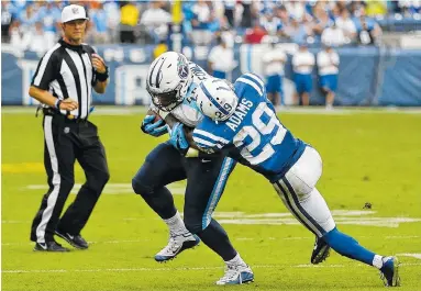  ?? THE ASSOCIATED PRESS ?? Tennessee fullback Jalston Fowler is stopped by Indianapol­is safety Mike Adams on a 2-point conversion attempt to tie the game in the final seconds of the fourth quarter Sunday.