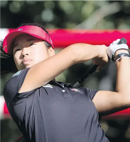  ?? LYLE ASPINALL ?? Jaclyn Lee hits a tee shot during Monday’s practice round at Priddis Greens Golf and Country Club, where the teen will be playing in her first Canadian Open. “I really do like the course,’’ said Lee. “It’s such a coincidenc­e that my first LPGA event —...