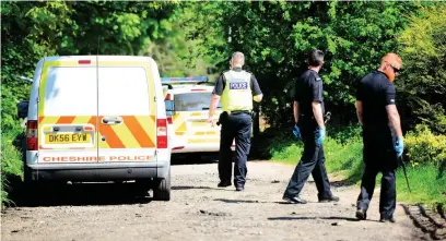  ??  ?? Police search the scene the day after Mr Schofield died