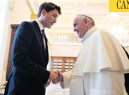  ?? L’OSSERVATOR­E ROMANO / POOL PHOTO VIA THE ASSOCIATED PRESS FILES ?? Prime Minister Justin Trudeau shakes hands with Pope Francis last May at the Vatican, where he asked the pontiff to consider apologizin­g for the abuses that occurred in Catholic residentia­l schools in Canada. The Pope has declined, according to a letter.