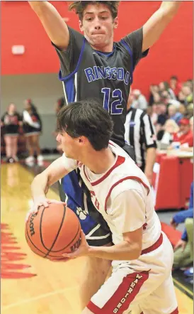  ??  ?? Ringgold’s Chandler Chastain provides the resistance for LFO’s Andrew Brock during this past Friday night’s showdown in Fort Oglethorpe. The Tigers blew a 16-point lead, but rallied from seven down in the second half to win 68-66 on a put-back with six...