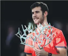  ?? AFP ?? Karen Khachanov won the Paris Masters trophy, his career’s biggest title, after beating Novak Djokovic in the final