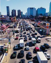  ?? Ted Shaffrey/Associated Press ?? People wait to drive through the Holland Tunnel into New York City during morning rush hour traffic in Jersey City, N.J., in 2023.