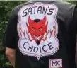  ??  ?? A Satan’s Choice member sports the club’s grinning devil patch.