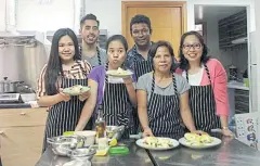  ??  ?? Chef Kaushic Biswas and co-trainer Preston Hartwick pose with students (from left) Joy, Elaine, Gloria and Elsa at Taste of Hope in Hong Kong.