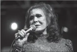  ?? Associated Press ?? ■ Loretta Lynn performs at the BBC Music Showcase at Stubb's during South By Southwest in Austin, Texas. The eight-time CMA winner was the very first female vocalist of the year and she's planning be at the 50th annual CMA Awards next Wednesday as many...