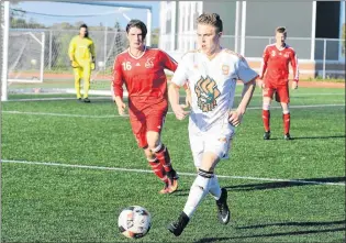  ?? VAUGHAN MERCHANT/CBU ATHLETICS ?? David Goulding of the Memorial Sea-hawks keeps an eye to Cape Breton University rookie Charlie Waters during an AUS soccer game Saturday in Sydney, N.S. MUN lost the game 3-2.