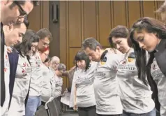  ?? J. SCOTT APPLEWHITE, AP ?? Immigratio­n activists pray May 20 on Capitol Hill before the Senate Judiciary Committee began working on an immigratio­n bill.