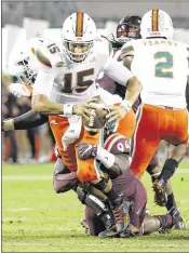  ?? STEVE HELBER / ASSOCIATED PRESS ?? Quarterbac­k Brad Kaaya is sacked by Virginia Tech’s Trevon Hill in last week’s 37-16 loss. UM’s offensive linemen vow to correct their errors as they head into the Notre Dame game.