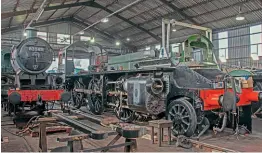  ?? ?? The rods and chassis of LMS 2-6-0 No. 13268 and new-build Standard 3MT
No. 82045, with No. 4930 in the background, inside the shed on September 15. No. 82045 is on road two, which will be levelled and be used for work benches and machinery.