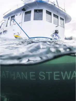  ?? HEILTSUK FIRST NATION / THE CANADIAN PRESS FILES ?? The tugboat Nathan E. Stewart is seen after it ran aground in the waters of the Seaforth Channel near Bella Bella, B.C., in 2016, spilling thousands of litres of fuel into the ocean. A report into the incident called for more training on crew fatigue.