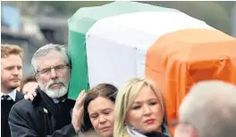  ??  ?? PALLBEARER­S Sinn Fein’s Gerry Adams, Mary Lou McDonald and Michelle O’Neill